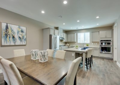 Open-plan modern kitchen with island and dining