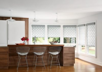Modern kitchen island with three wire stools