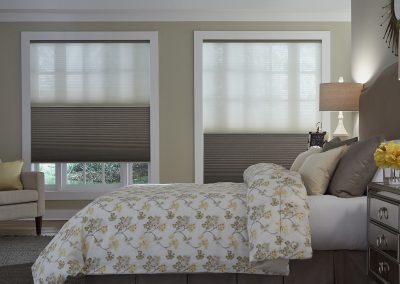 Cozy bedroom with dual cellular shades
