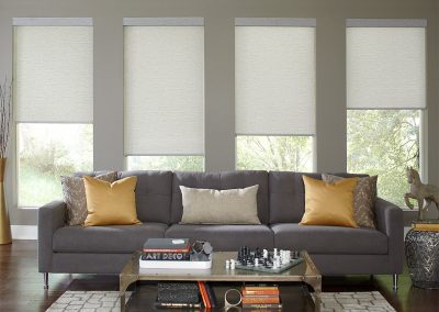 Gray sofa with gold pillows and chessboard