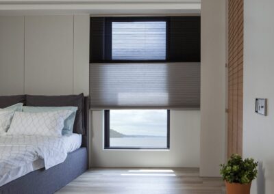 Modern bedroom with ocean view through window