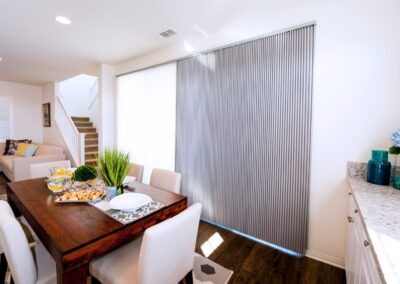 Bright dining room with vertical sliding blinds