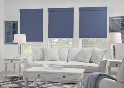 White living room with blue roller blinds