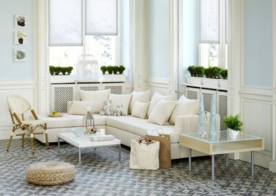Bright living room with cream sectional and plants