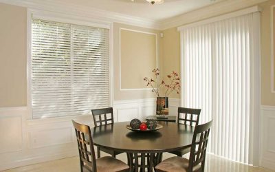 Round dining table with chairs and blinds