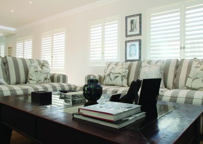 Living room with striped sofas and coffee table