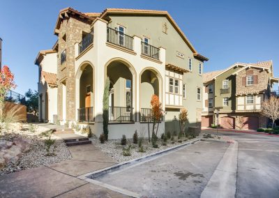 Mediterranean-style townhouse with arched balconies