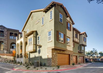 Modern three-story corner townhouse with garages