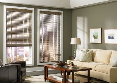 Contemporary living room with wooden blinds, city view