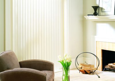 Sunlit living room with armchair and tulips
