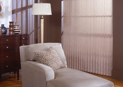 Beige chaise lounge with leopard pillow