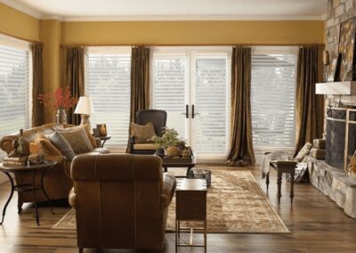 Cozy brown living room with stone fireplace
